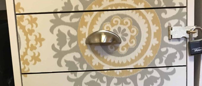 white filing cabinet with contact paper on the drawers for an updated look - square image